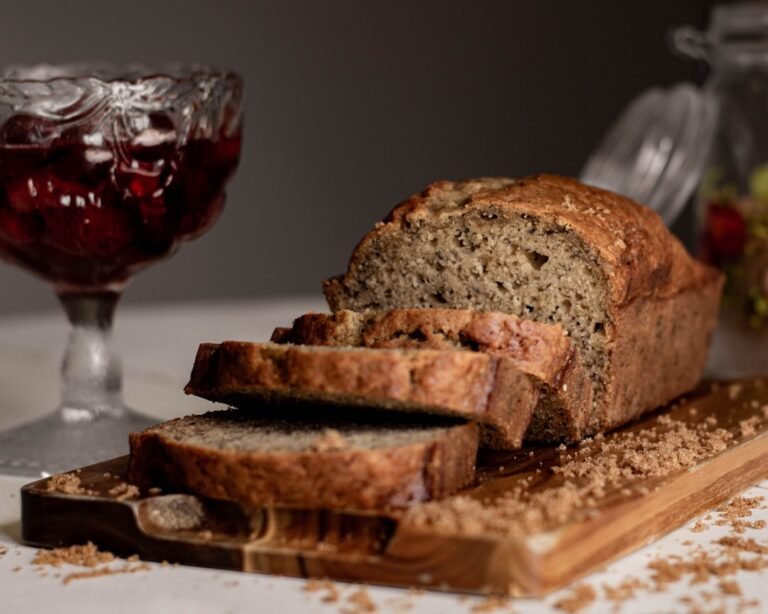 Easy homemade banana bread loaf sliced on a board
