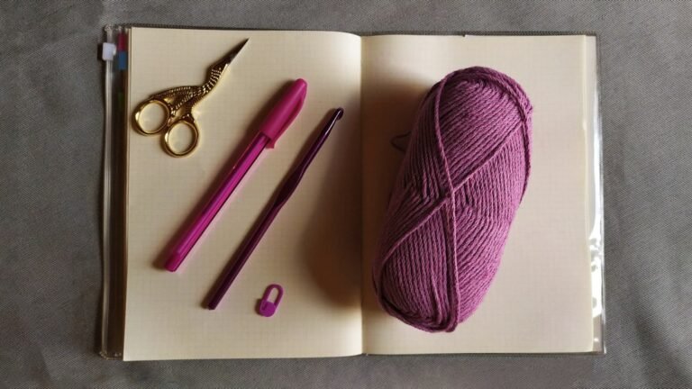 Yarn and notebook for an easy crochet bookmark pattern