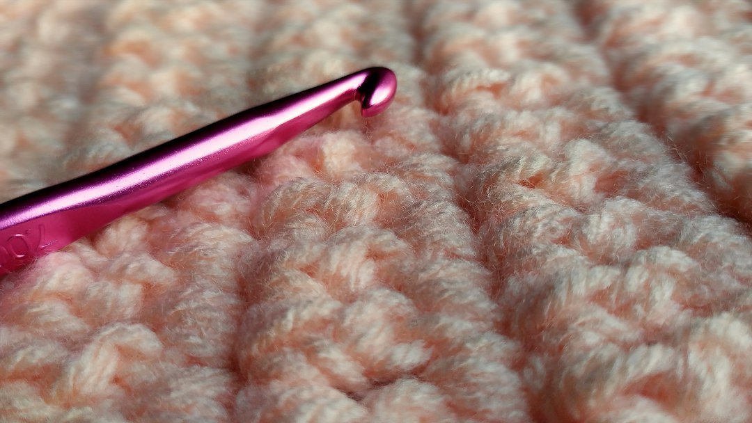 Crochet ribbing and crochet hook close up